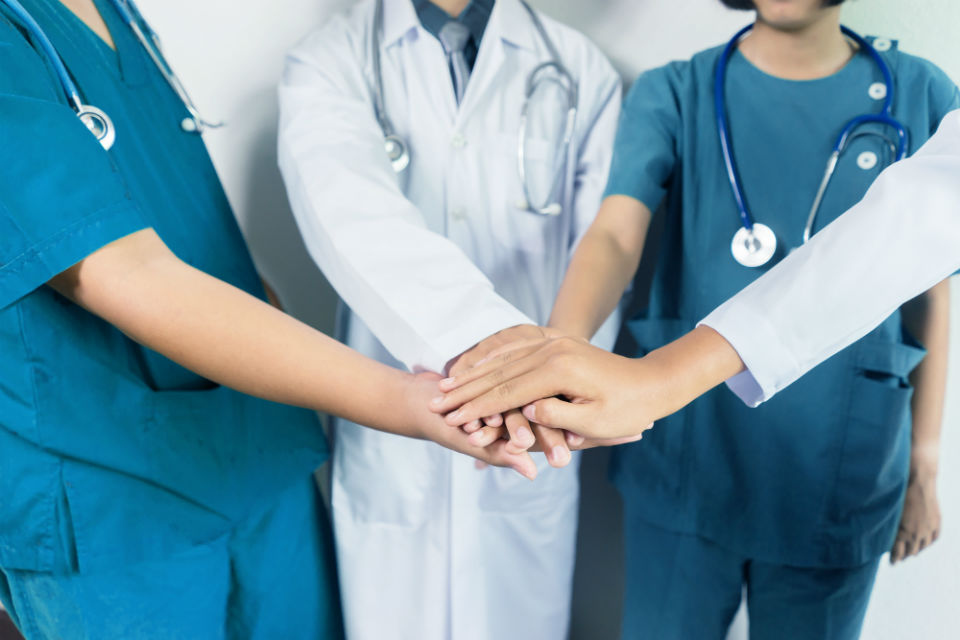 doctors-nurses-teamwork-hands-in