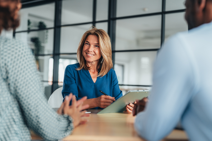 Woman smiling in office meeting